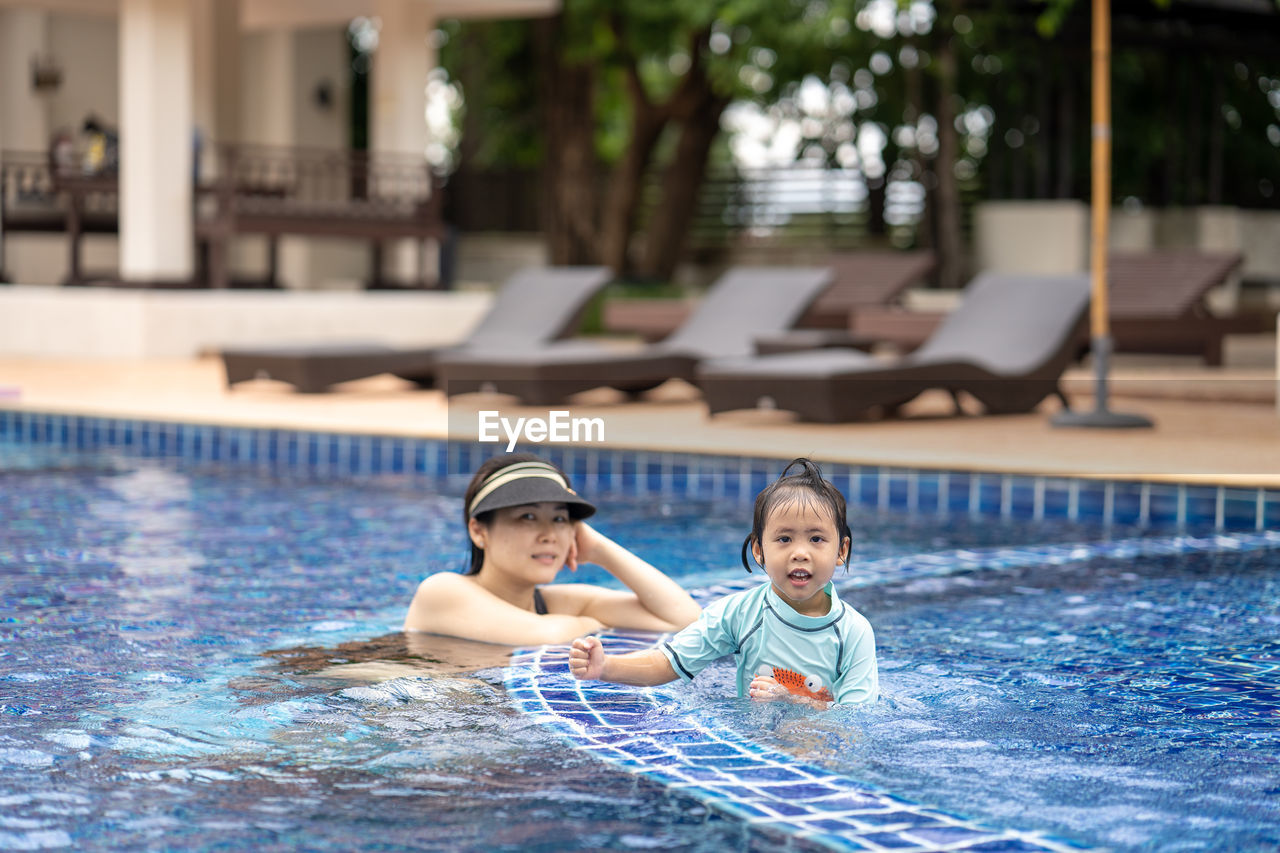 Boy swimming in pool