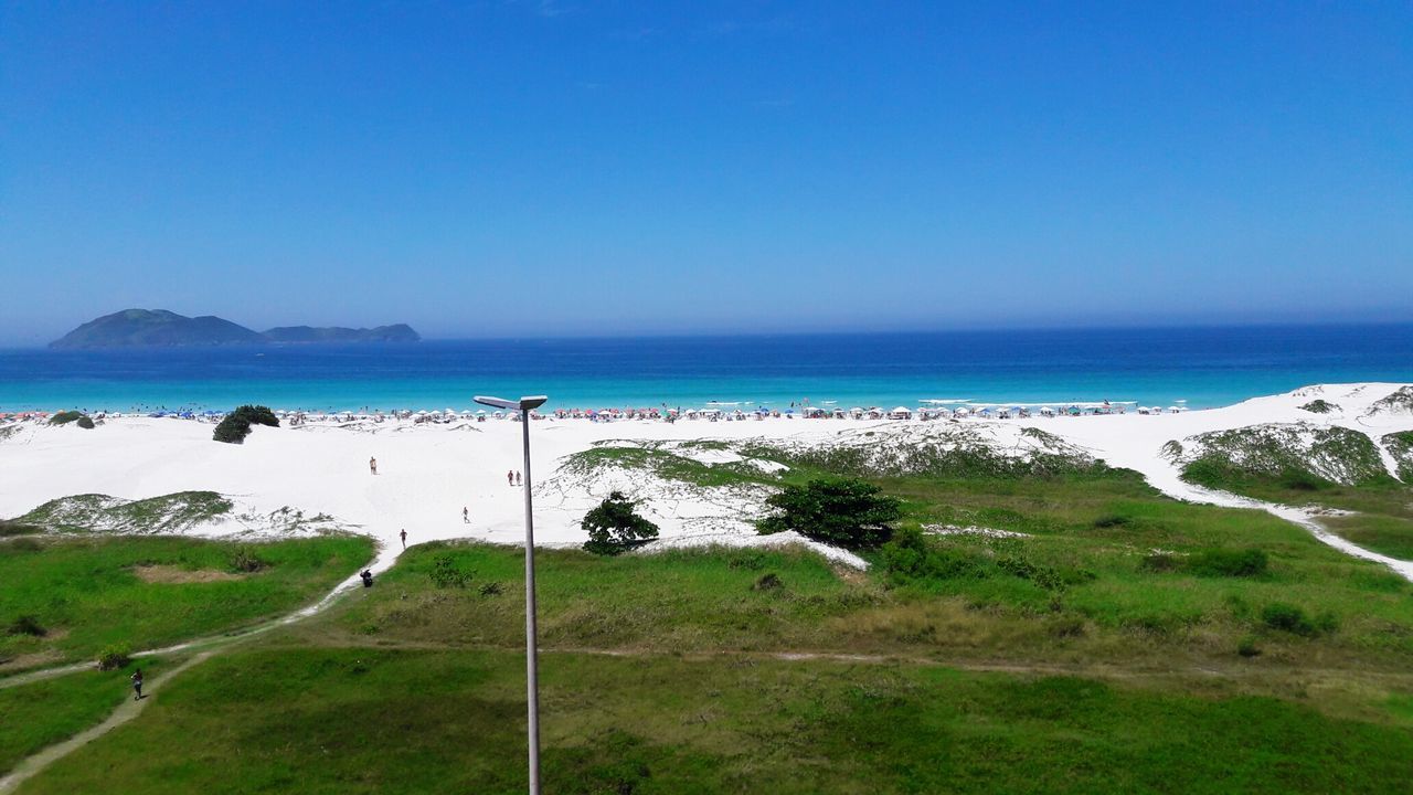 Scenic view of sea against clear blue sky