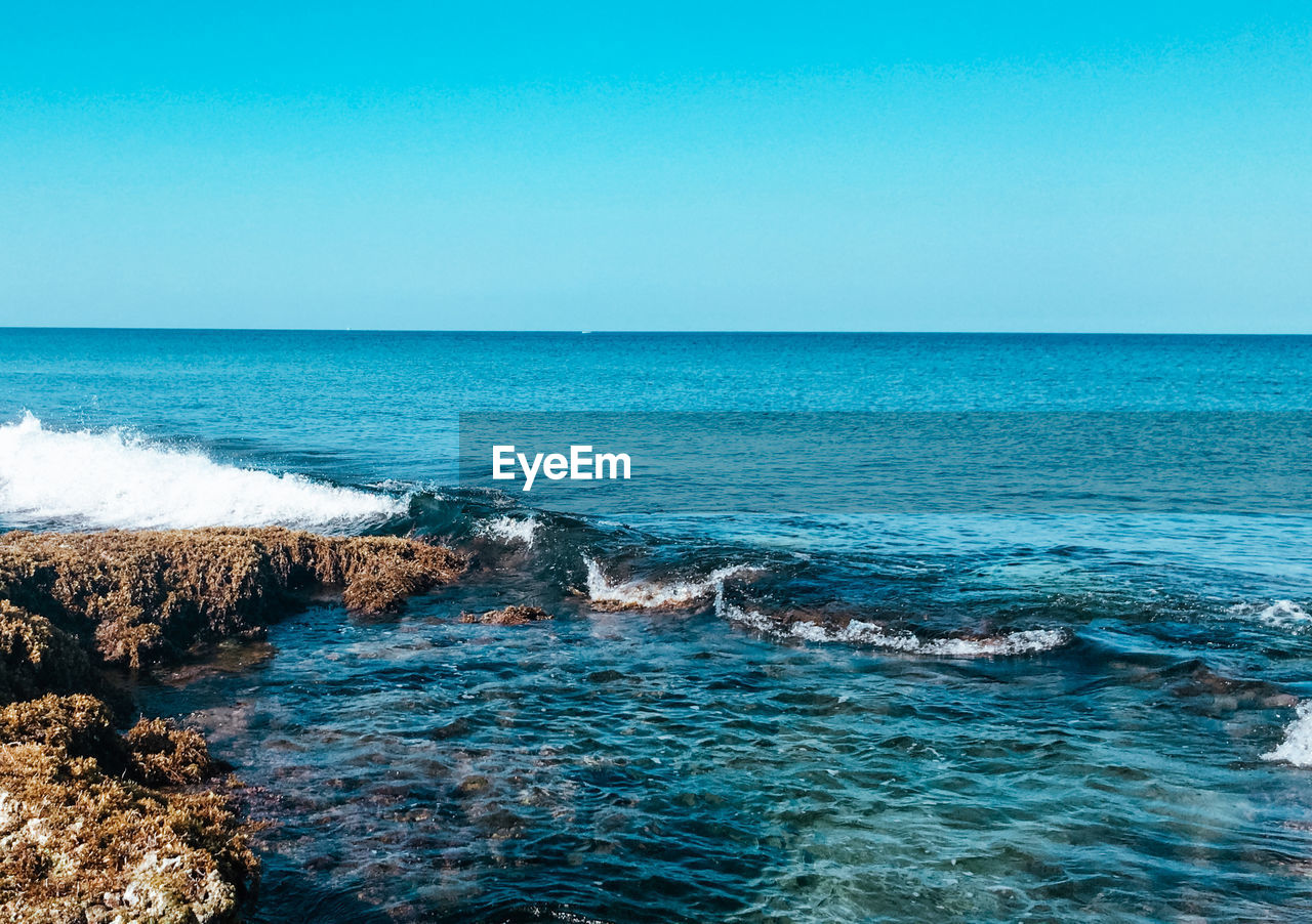 SCENIC VIEW OF SEA AGAINST BLUE SKY