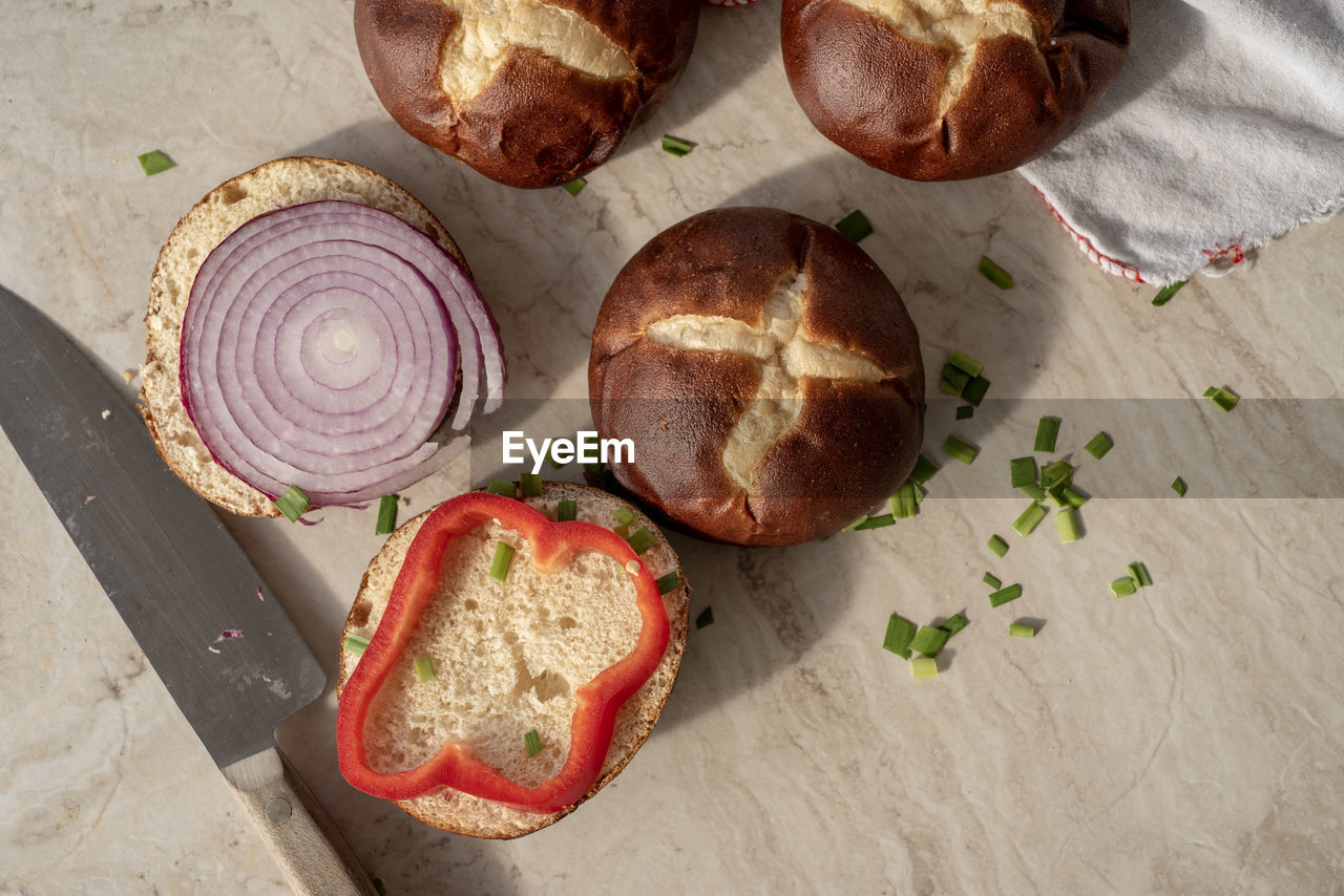 High angle view of sandwich rolls on table food preparation