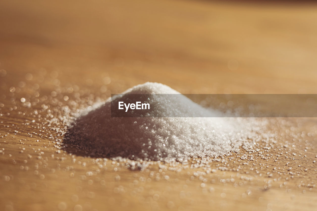 sand, close-up, macro photography, no people, selective focus, powder, land, food and drink, motion, nature, food, indoors, powdered sugar, water, sugar