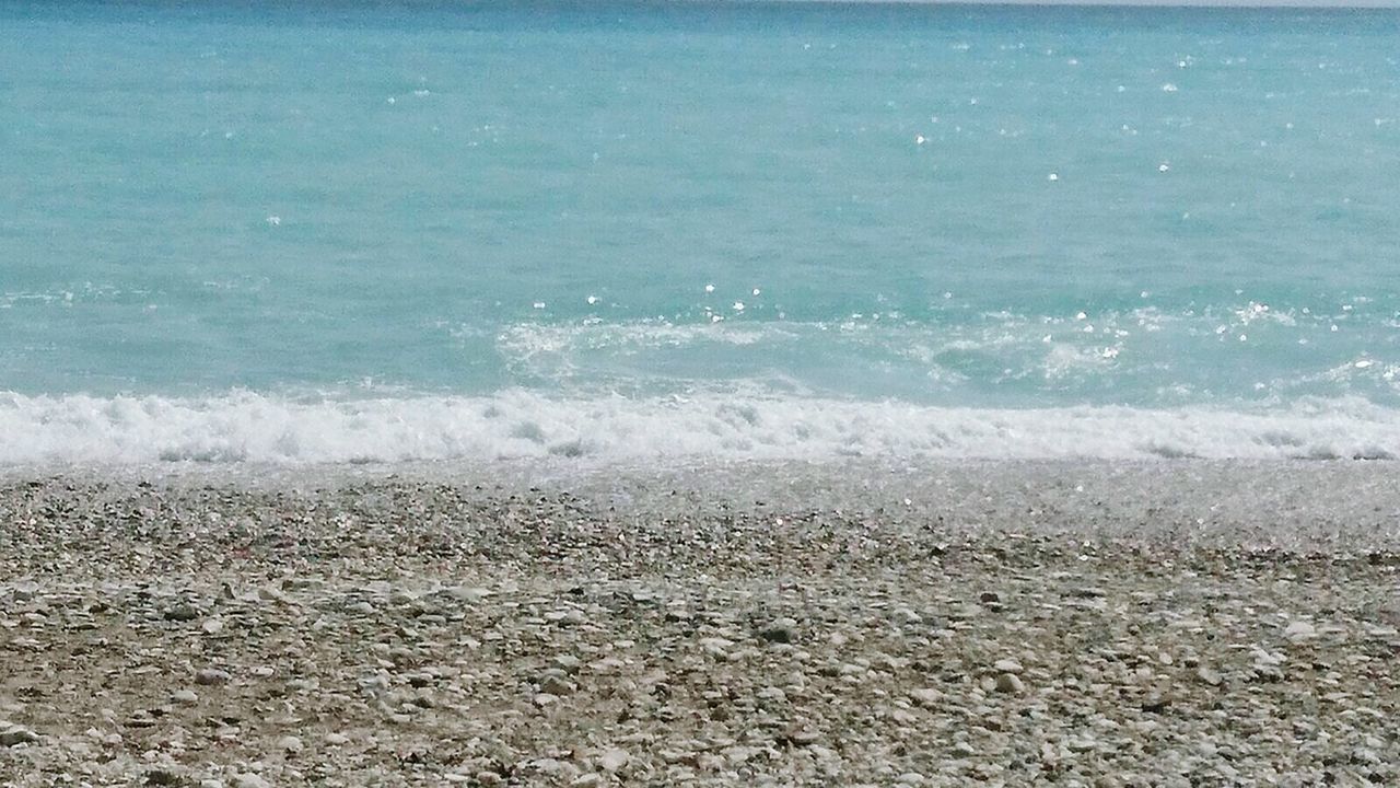 SEA WAVES SPLASHING ON BEACH