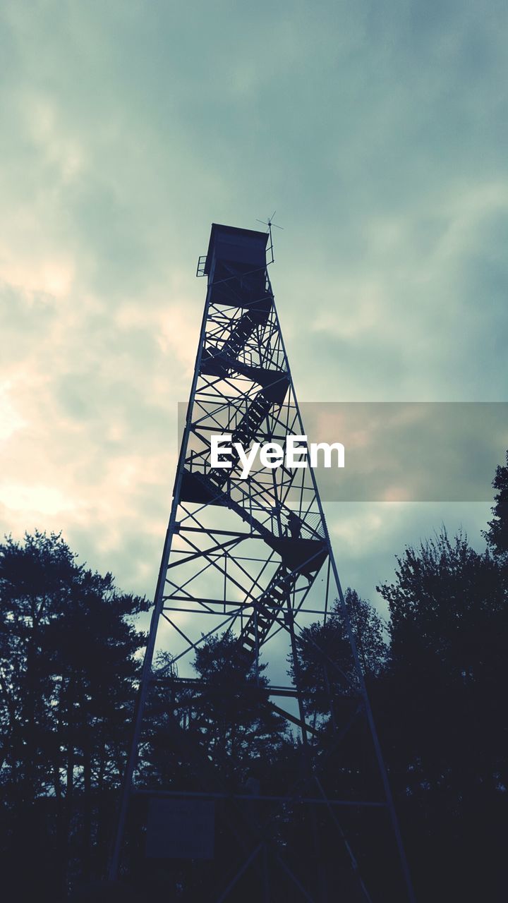 Low angle view of lookout tower against cloudy sky