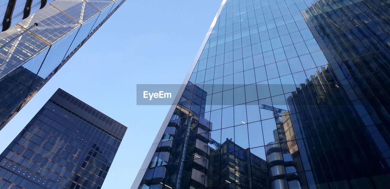 LOW ANGLE VIEW OF BUILDINGS AGAINST SKY