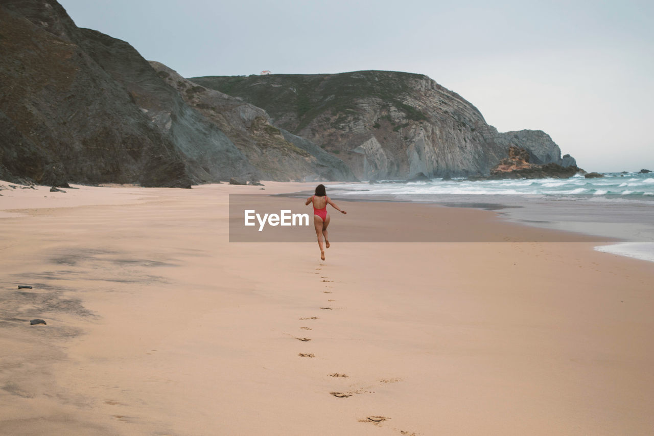 Full length of woman on beach