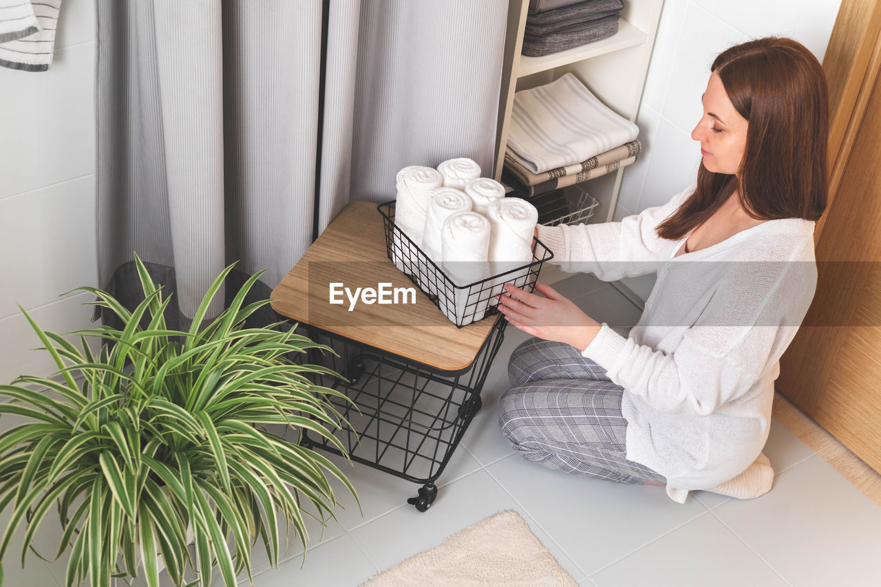 high angle view of young woman using digital tablet