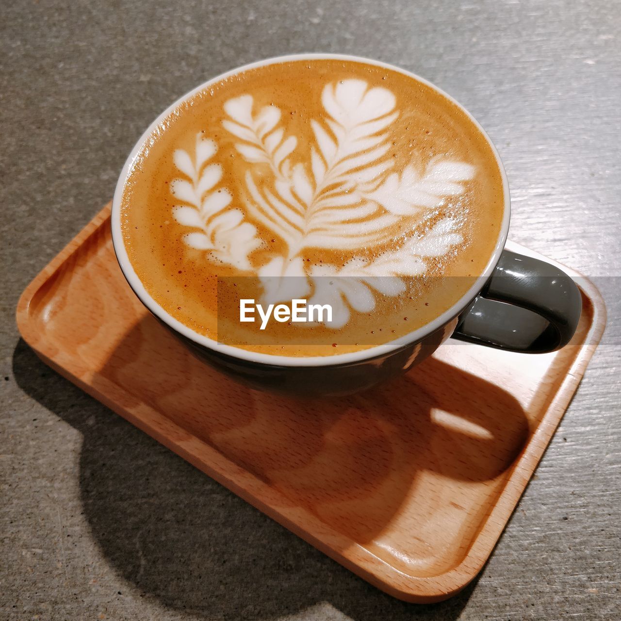 High angle view of coffee latte with latte art
