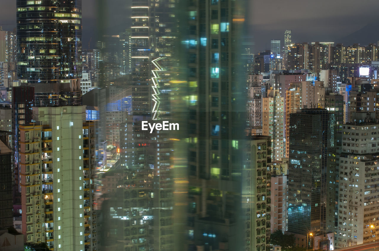 Illuminated buildings in city at night