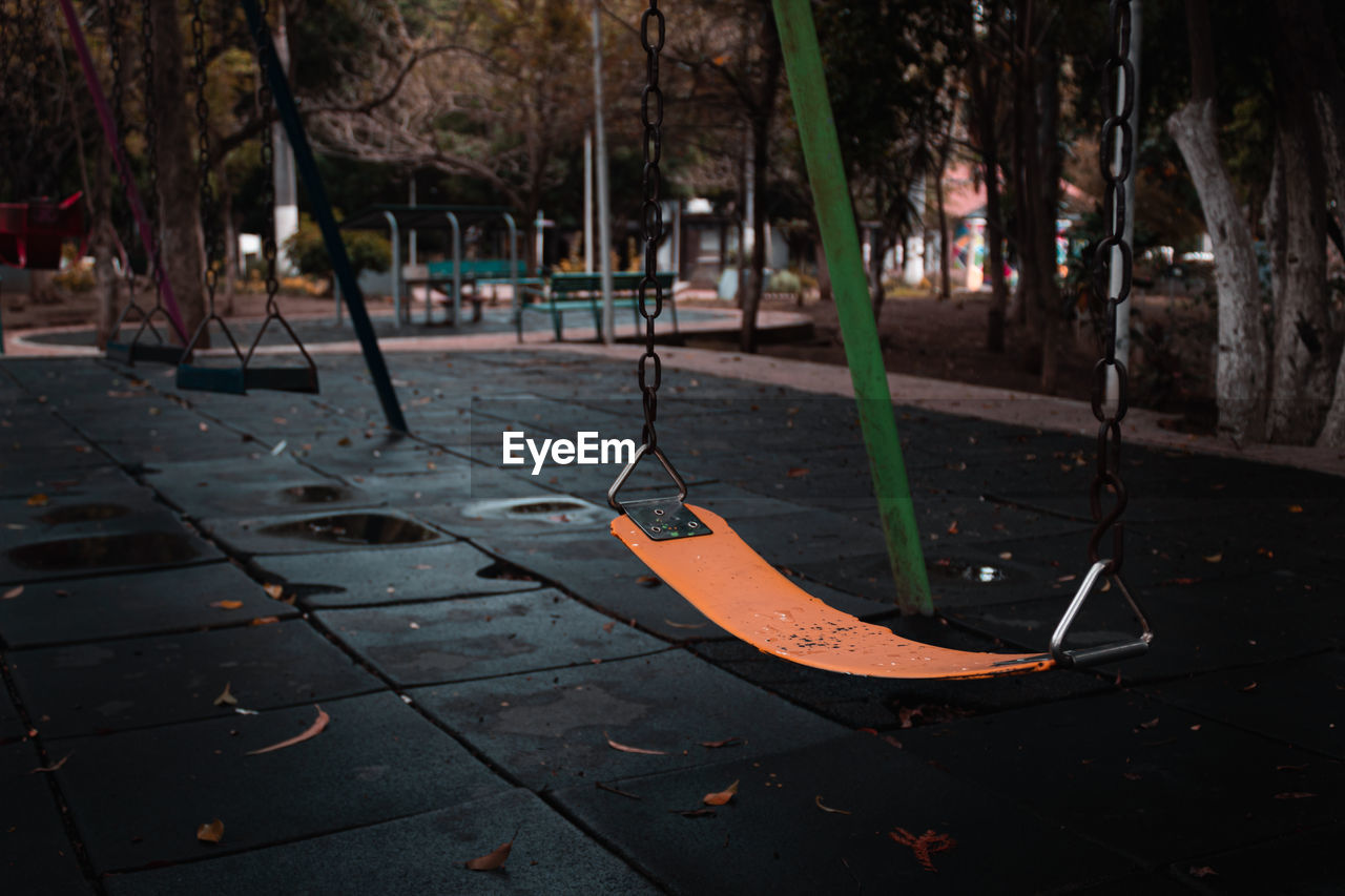 Empty swing in abandoned park