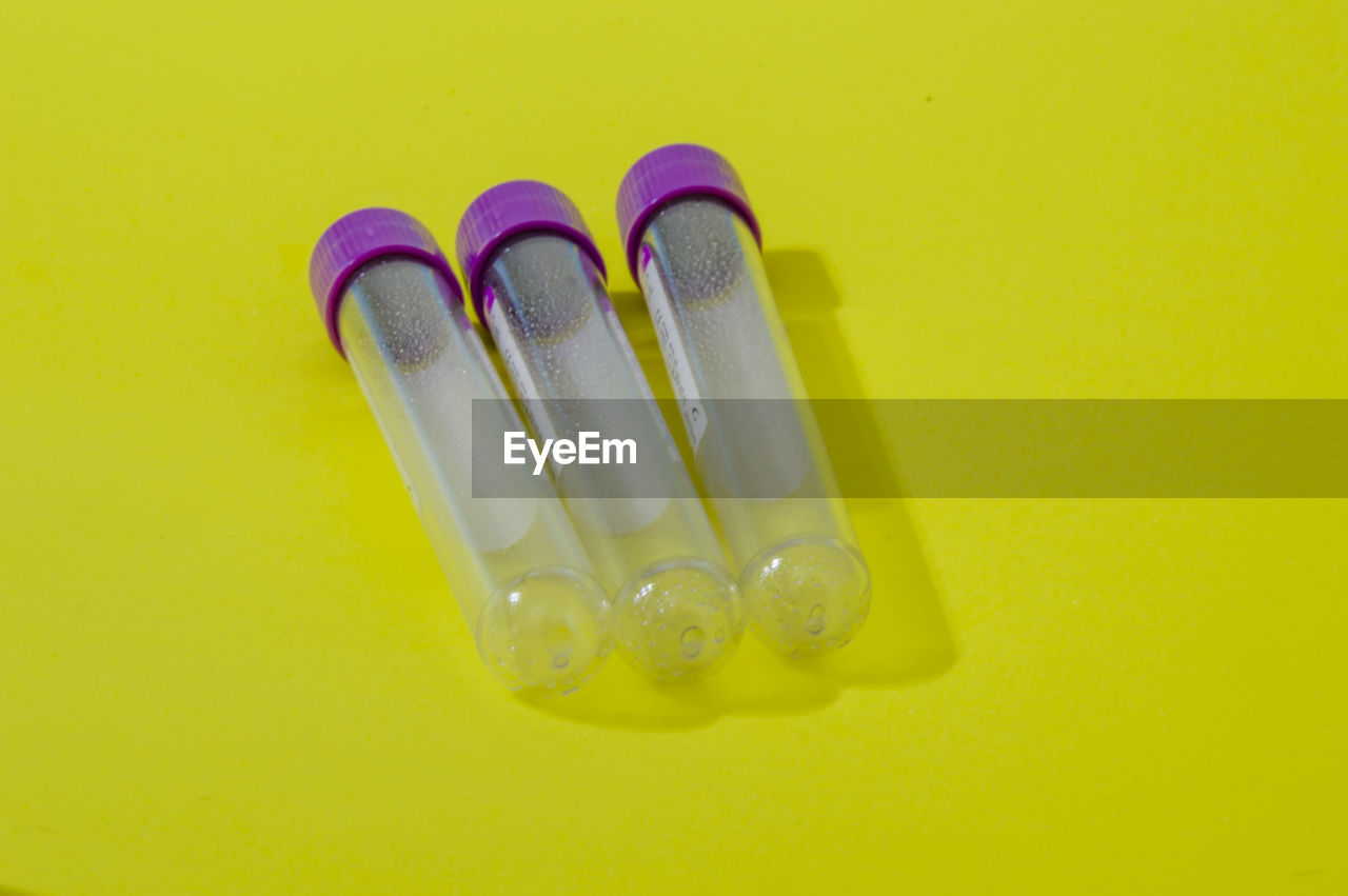 high angle view of dental equipment against yellow background