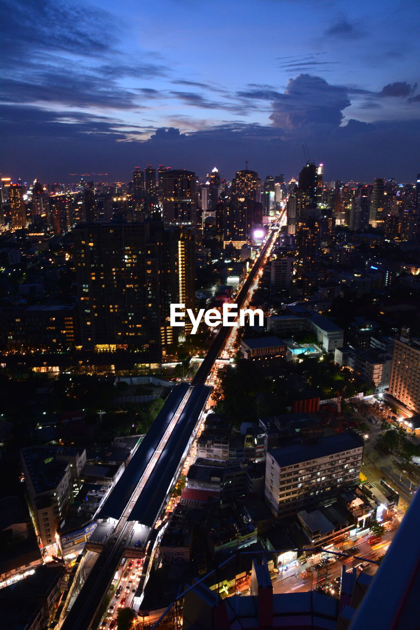 High angle view of illuminated city buildings at night