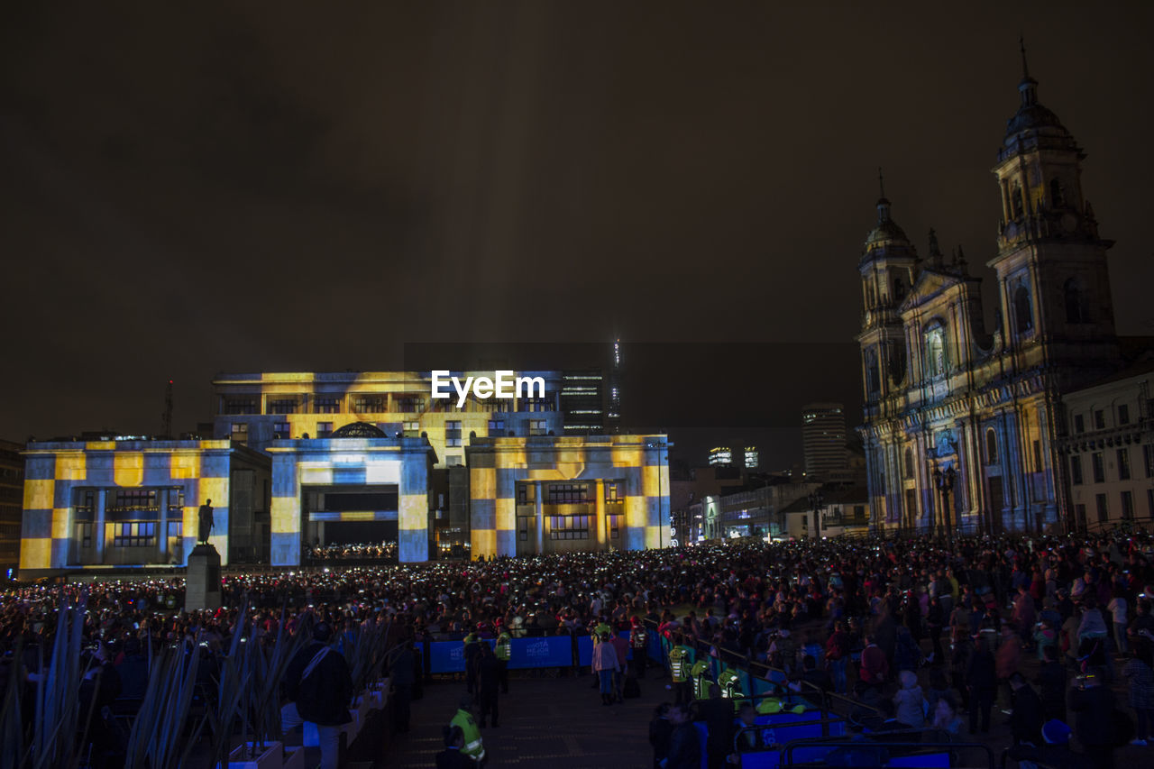 CROWD AT NIGHT IN CITY