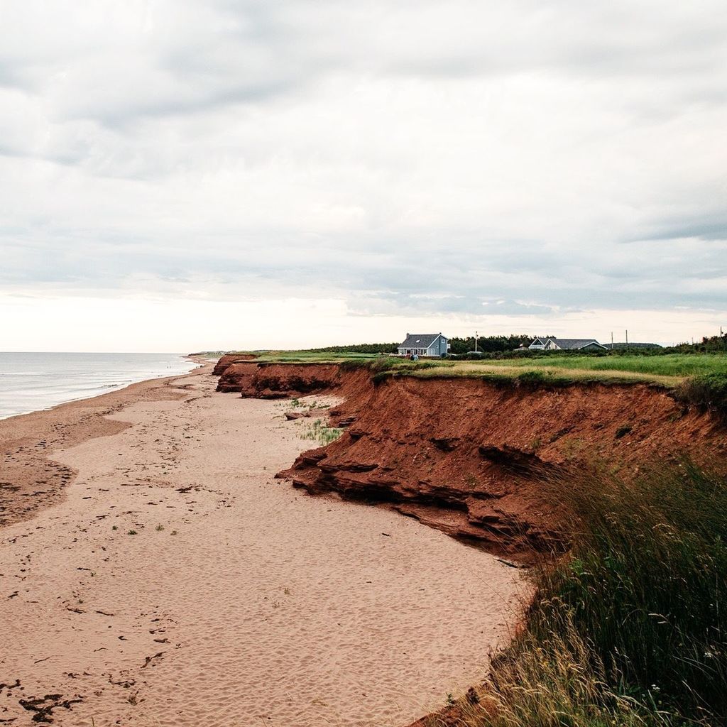 Idyllic view of beach against sky