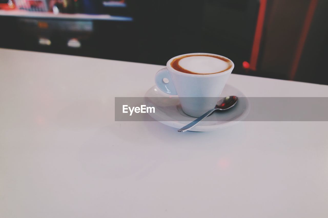 Espresso served in cup on table