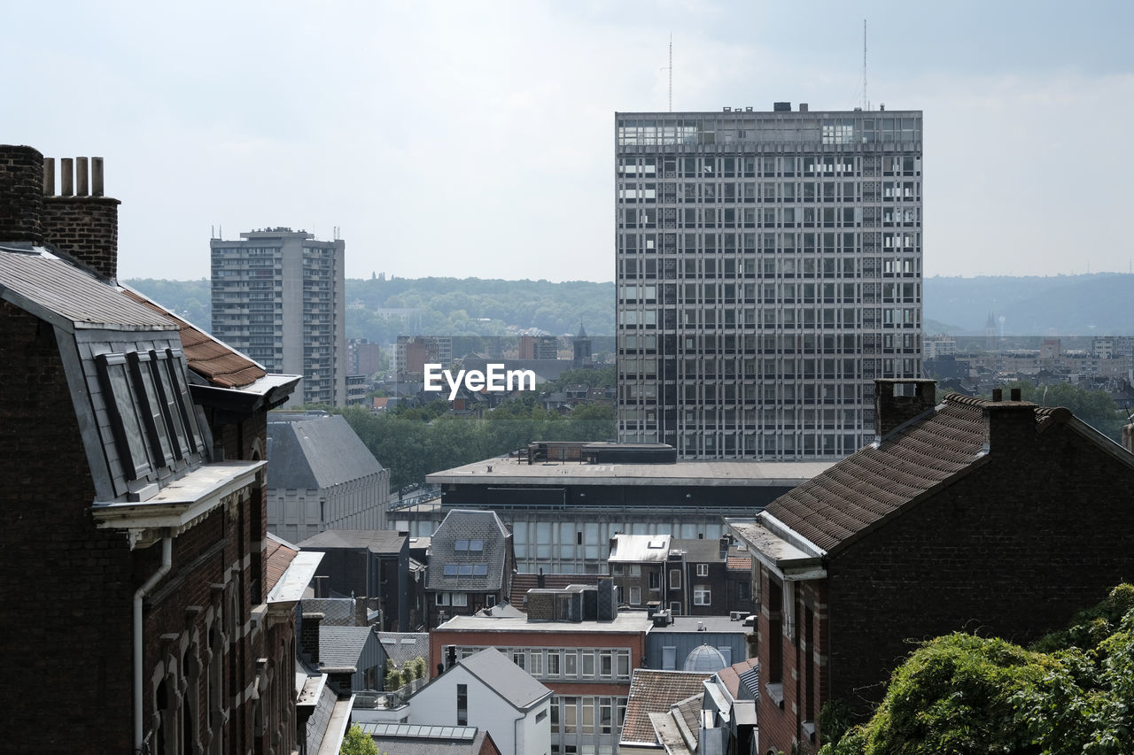 High angle view of buildings in city against sky