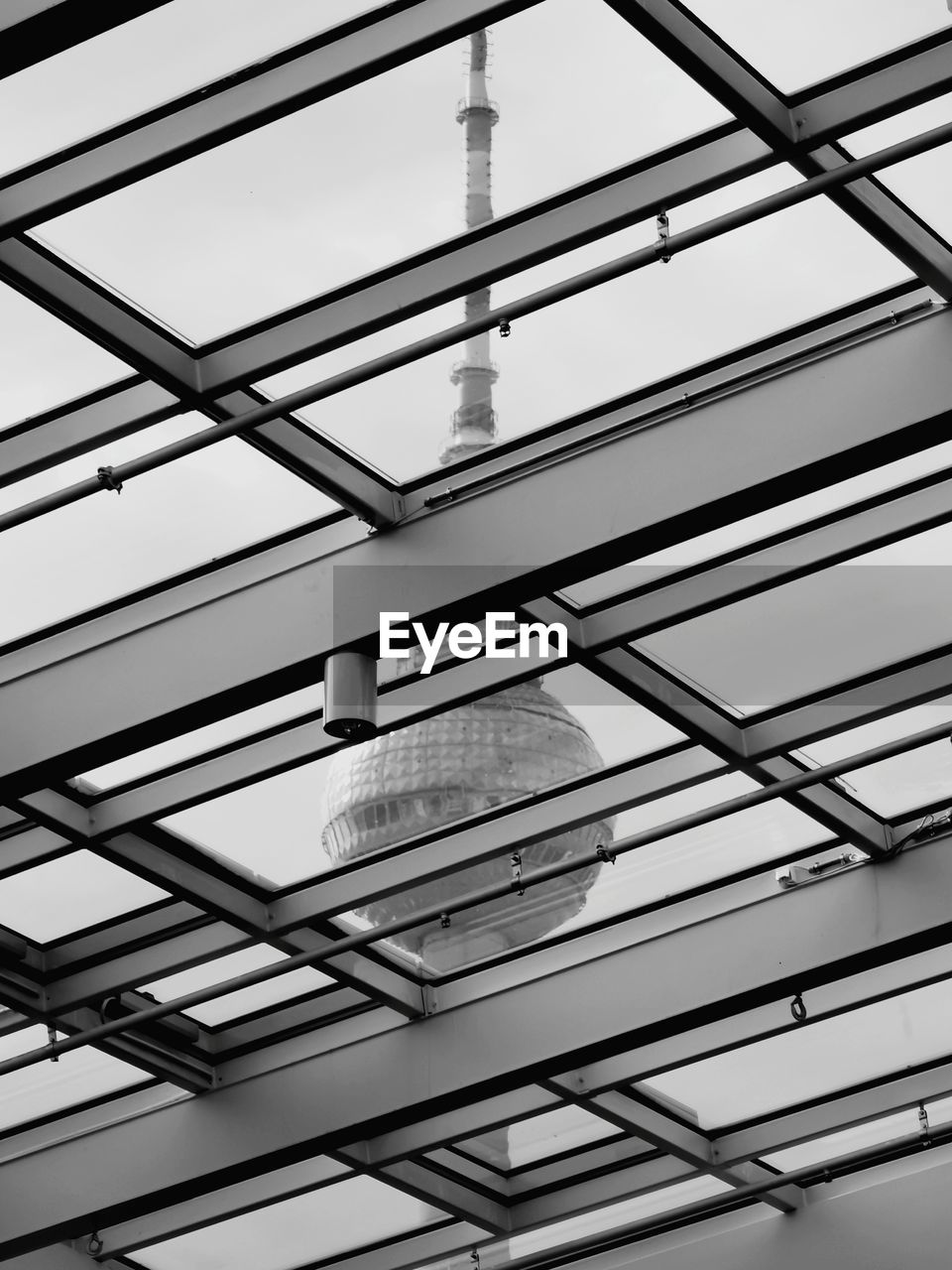 Low angle view of modern building ceiling against clear sky