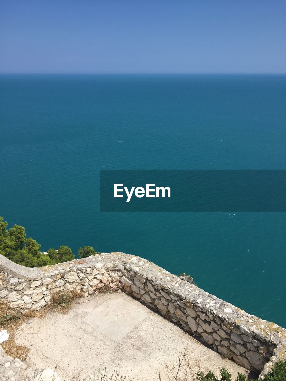 High angle view of sea against blue sky