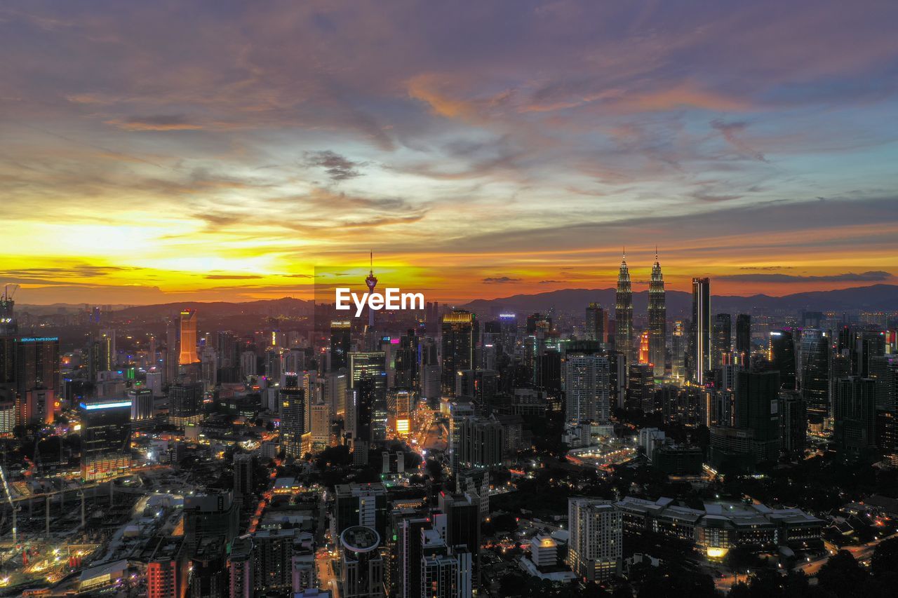 Aerial view of city during sunset