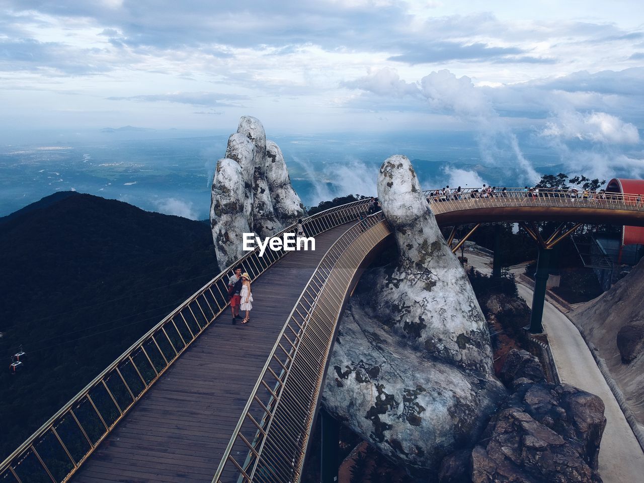 High angle view of bridge against cloudy sky