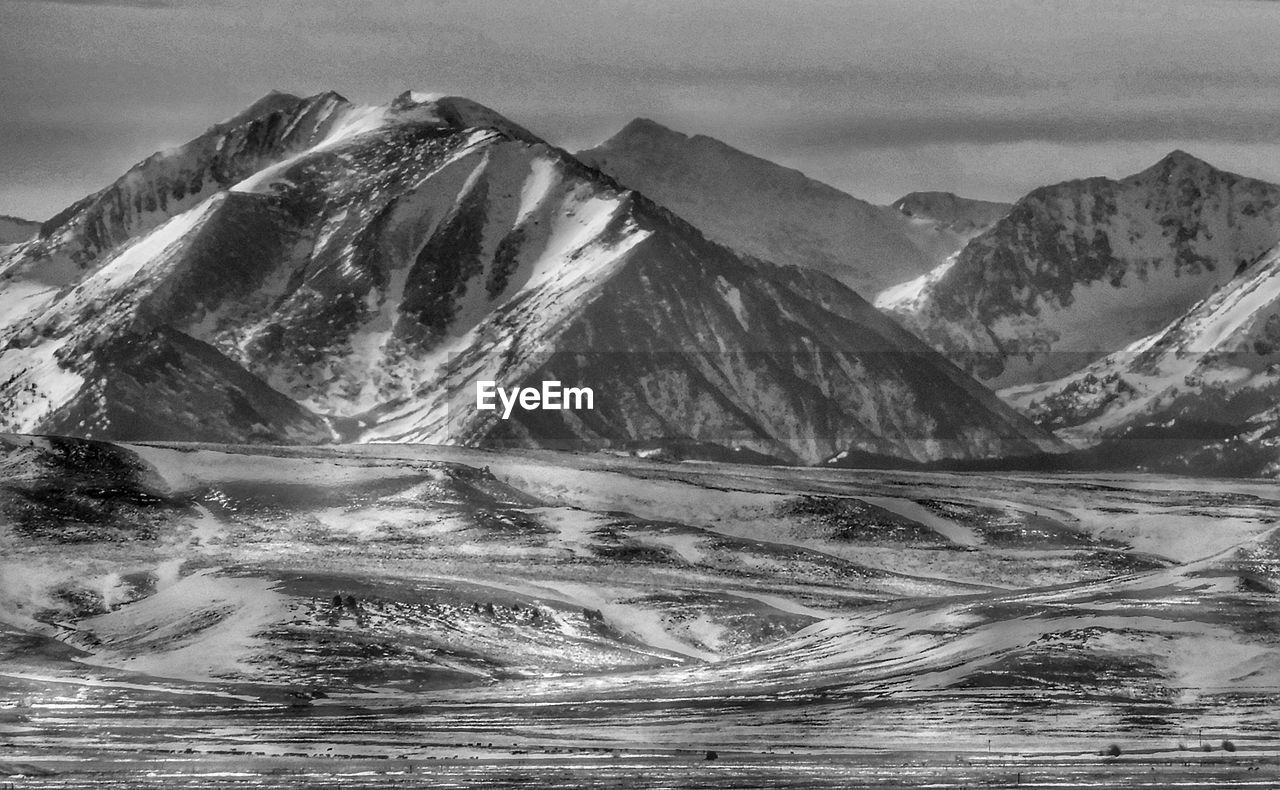 mountain, black and white, scenics - nature, environment, monochrome photography, landscape, mountain range, beauty in nature, monochrome, nature, water, cold temperature, snow, sky, no people, cloud, land, tranquility, tranquil scene, drawing, winter, snowcapped mountain, non-urban scene, travel destinations, outdoors, travel, day