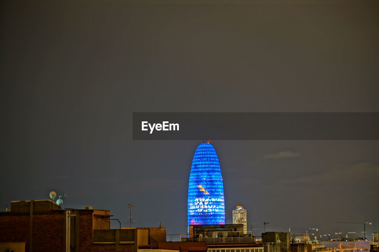 MODERN BUILDINGS IN CITY AGAINST SKY