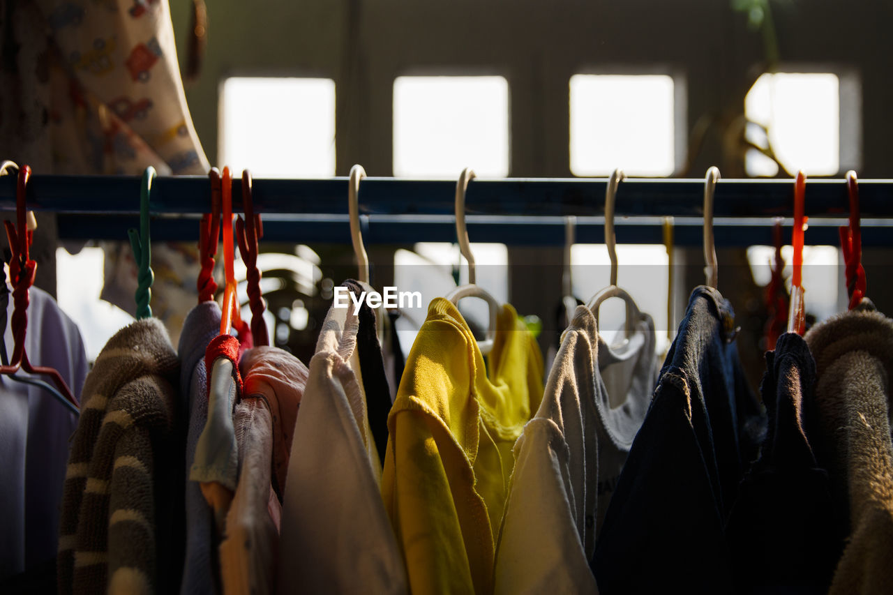 Clothes hanging on rack in store