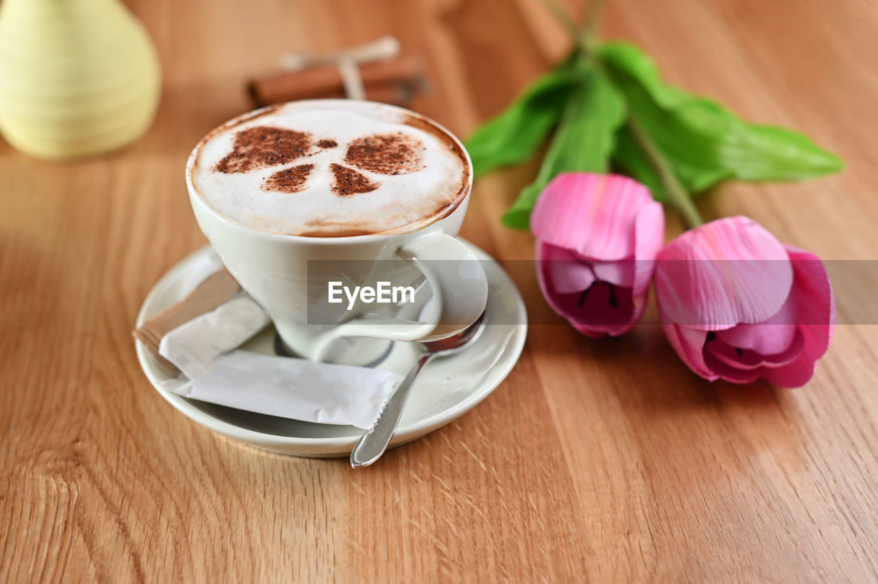 CLOSE-UP OF COFFEE SERVED ON TABLE