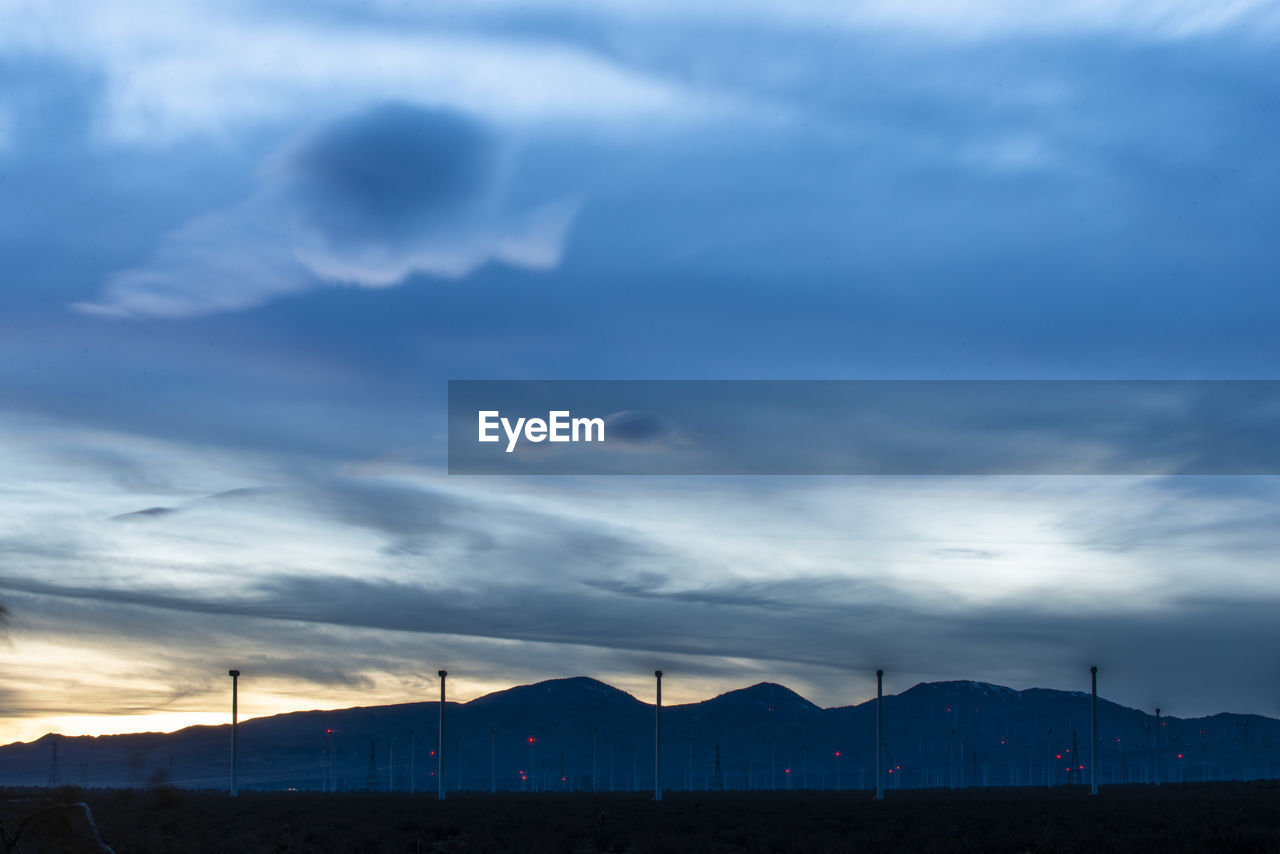 Windmills dot the mountainside near the mojave desert in cali