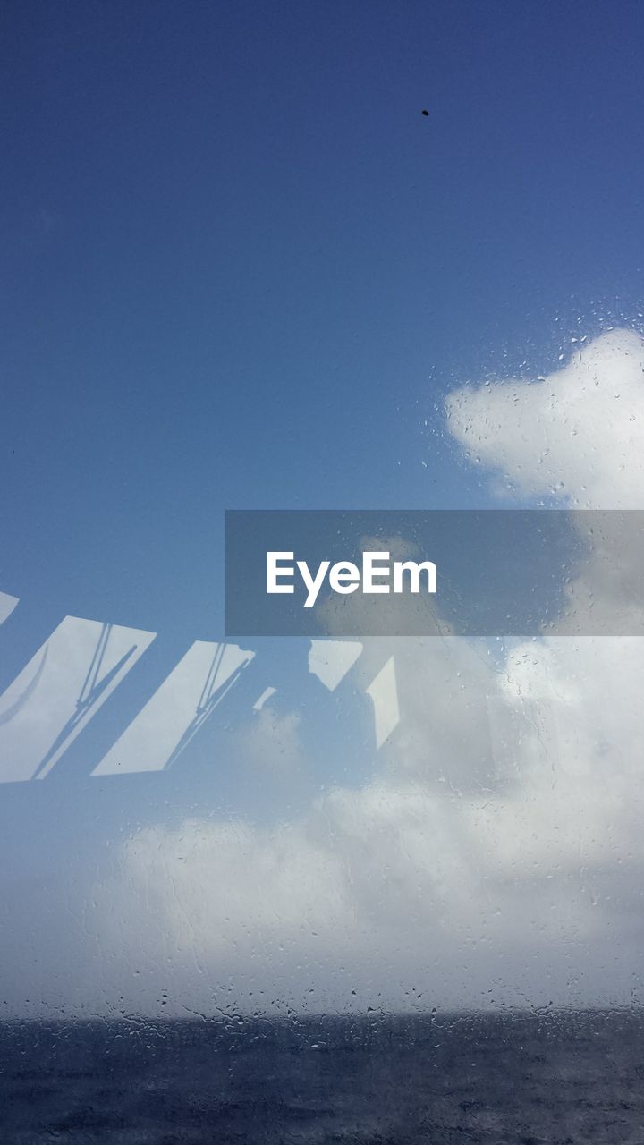 TILT IMAGE OF SEA AGAINST SKY