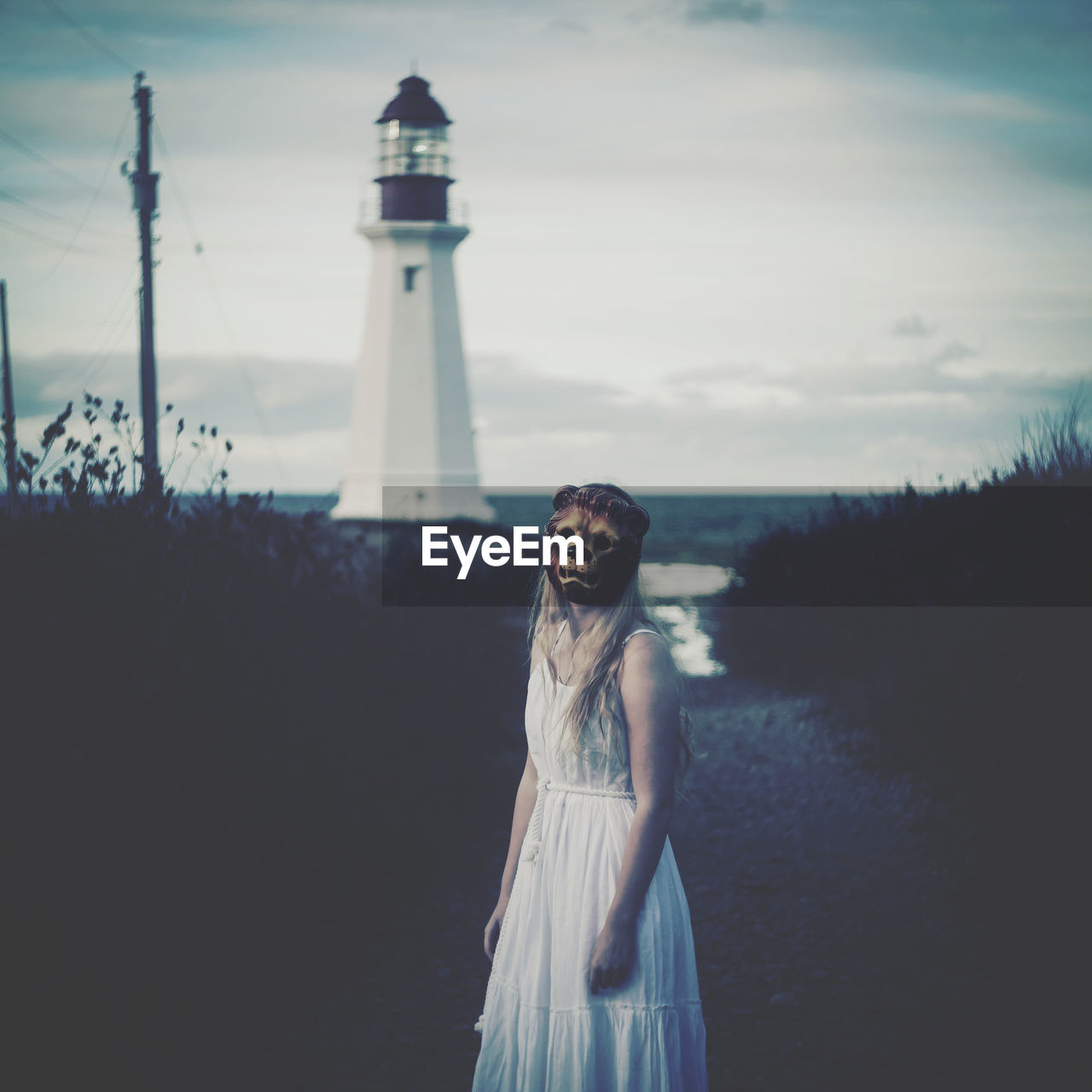 Rear view of woman standing against sky