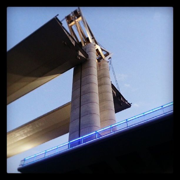 LOW ANGLE VIEW OF BUILT STRUCTURE AGAINST CLEAR BLUE SKY