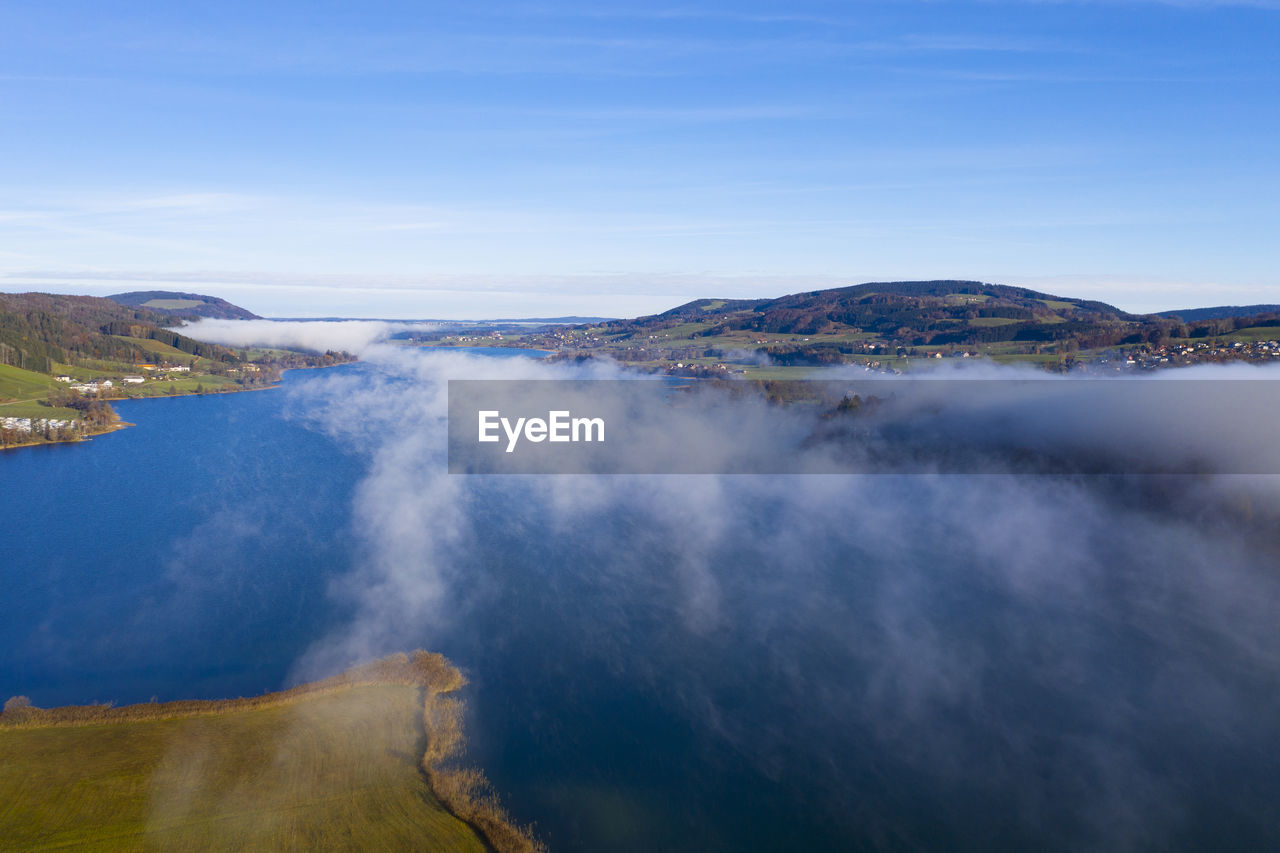 Drone view of fog floating over irrsee lake