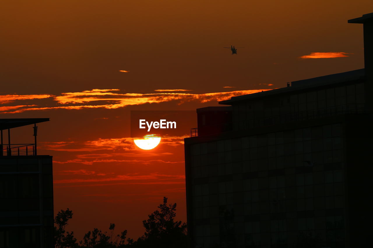 SILHOUETTE OF CITY AT SUNSET