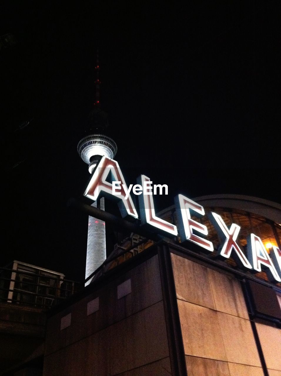 LOW ANGLE VIEW OF BUILDING AT NIGHT