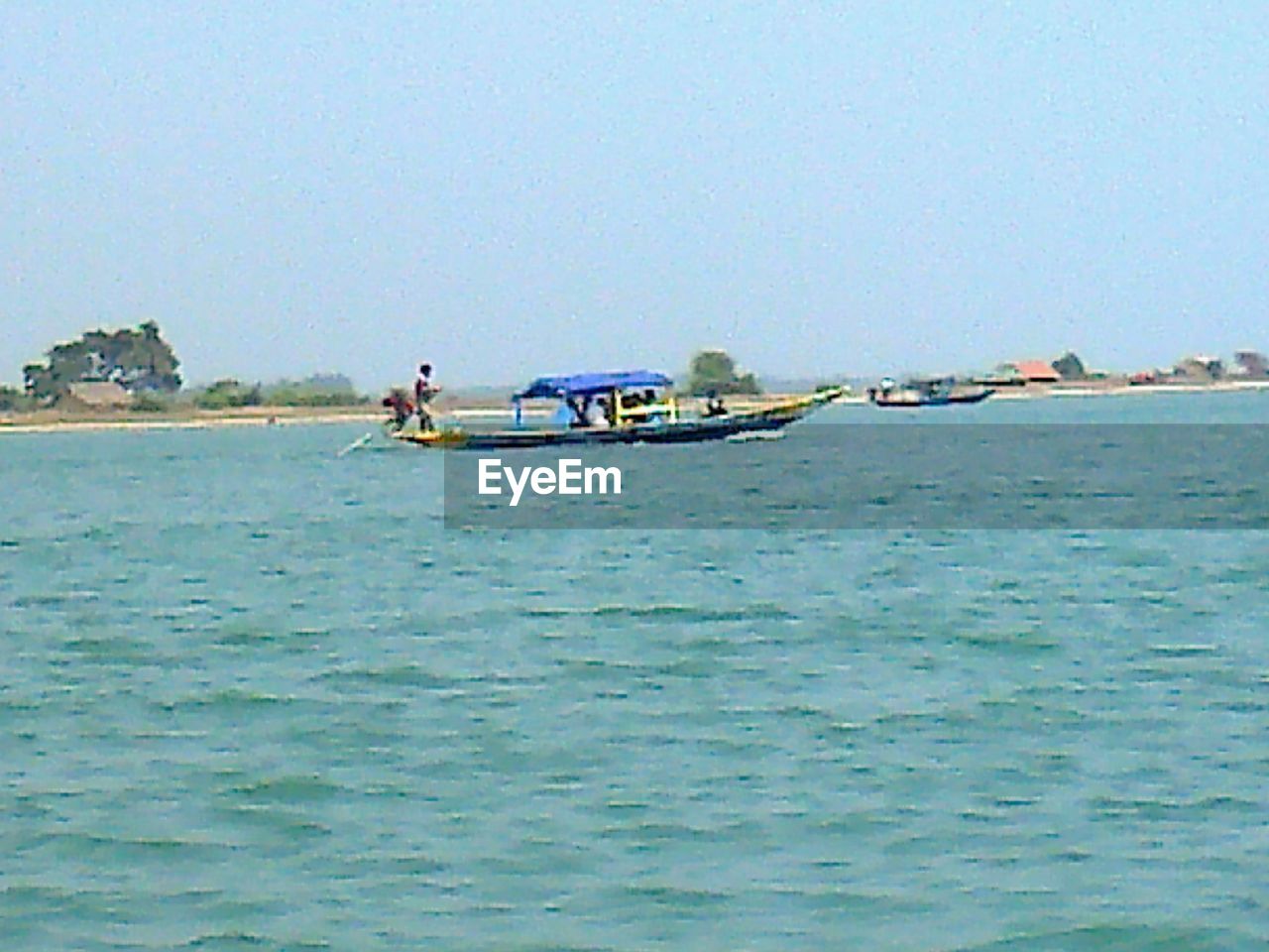 BOATS IN SEA AGAINST CLEAR SKY