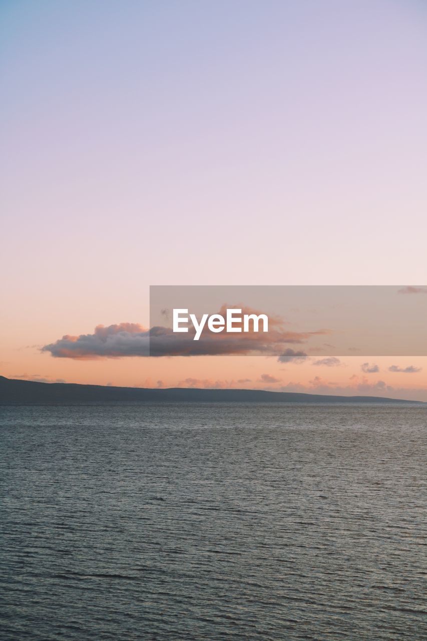 Scenic view of sea against clear sky during sunset