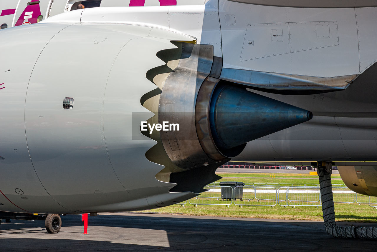 CLOSE-UP OF AIRPLANE AT AIRPORT