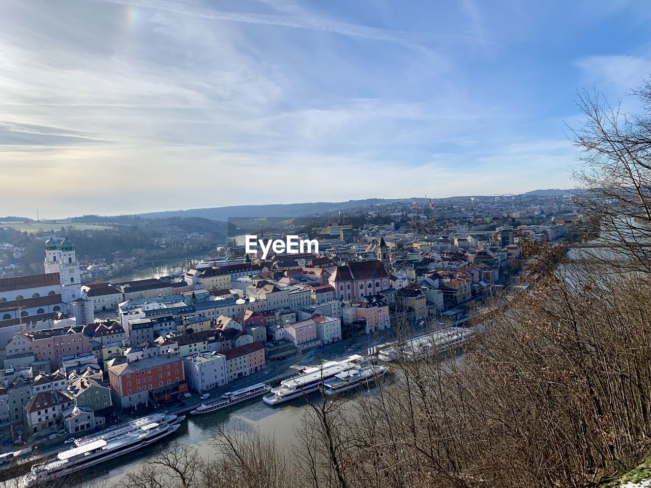 architecture, building exterior, city, built structure, sky, building, aerial photography, cityscape, nature, high angle view, water, urban area, cloud, transportation, no people, residential district, travel destinations, landscape, outdoors, winter, day, nautical vessel, aerial view, mode of transportation, house, travel, river, mountain, snow, tree, skyline, town, reflection, horizon, plant, environment