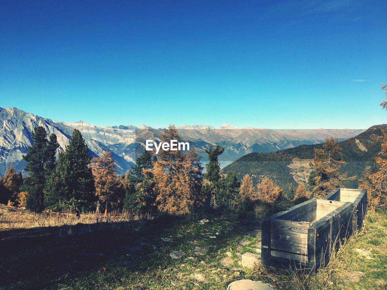 Scenic view of mountains against clear blue sky