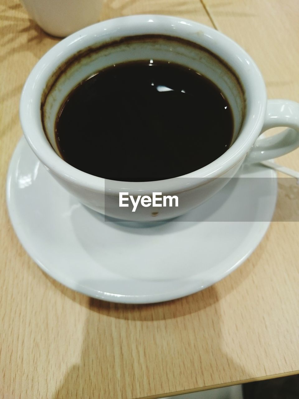 High angle view of black coffee on table