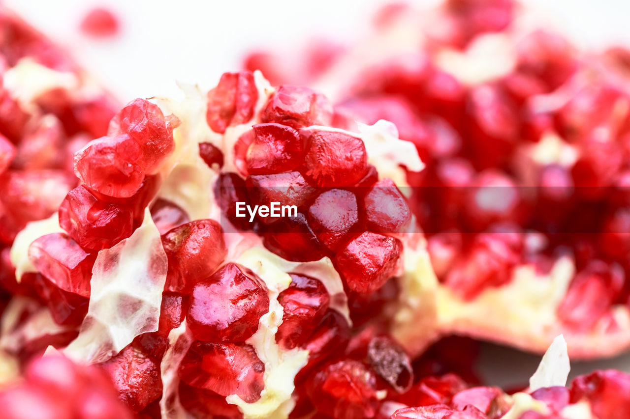 Close-up of pomegranate against white background