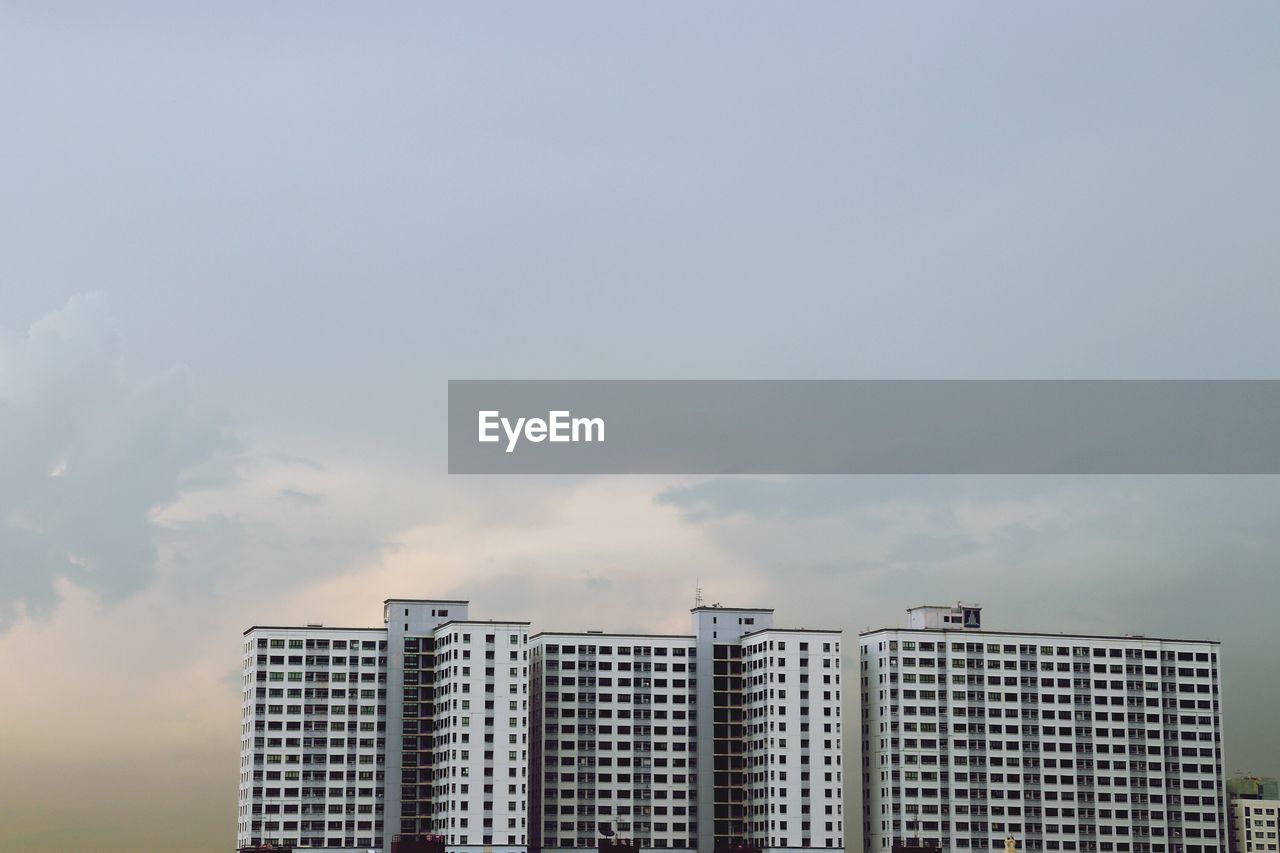 Buildings in city against sky