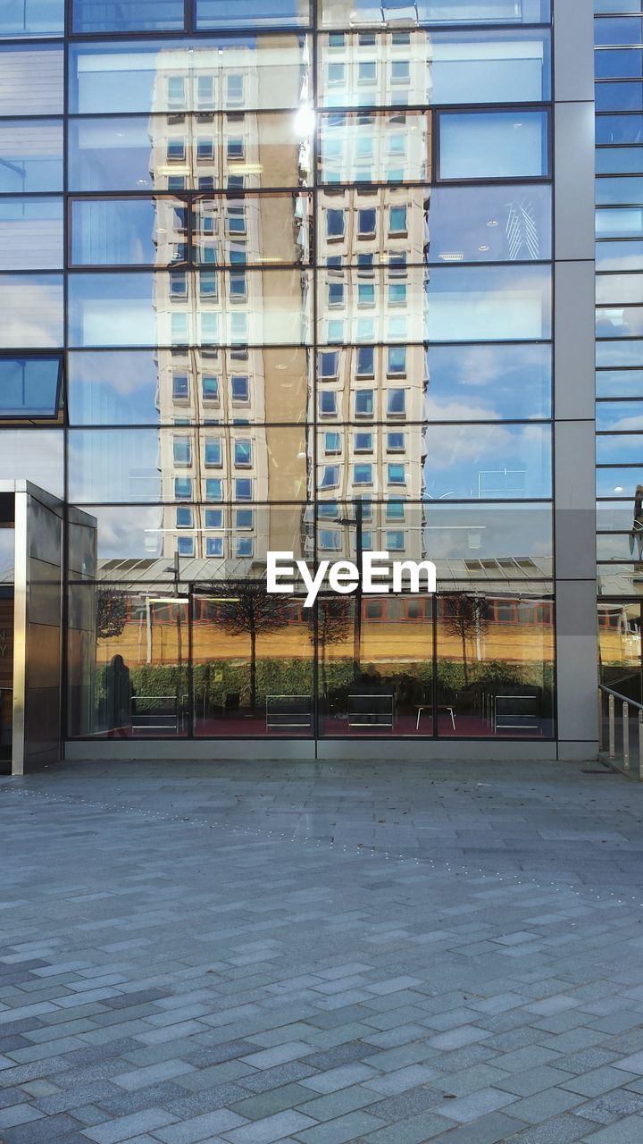 REFLECTION OF BUILT STRUCTURE ON GLASS