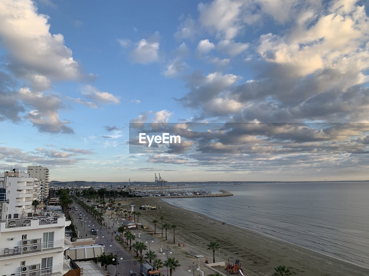 High angle view of beach and buildings against sky