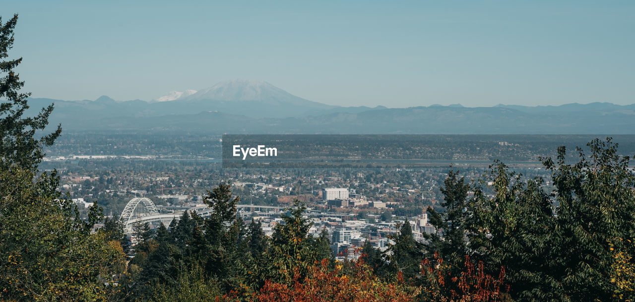 Aerial view of townscape against sky