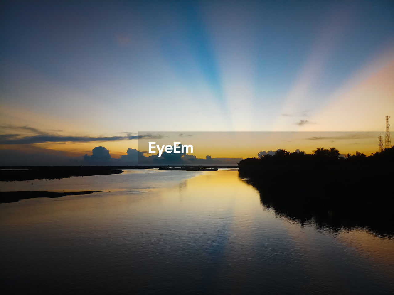 SCENIC VIEW OF LAKE AGAINST ORANGE SKY DURING SUNSET