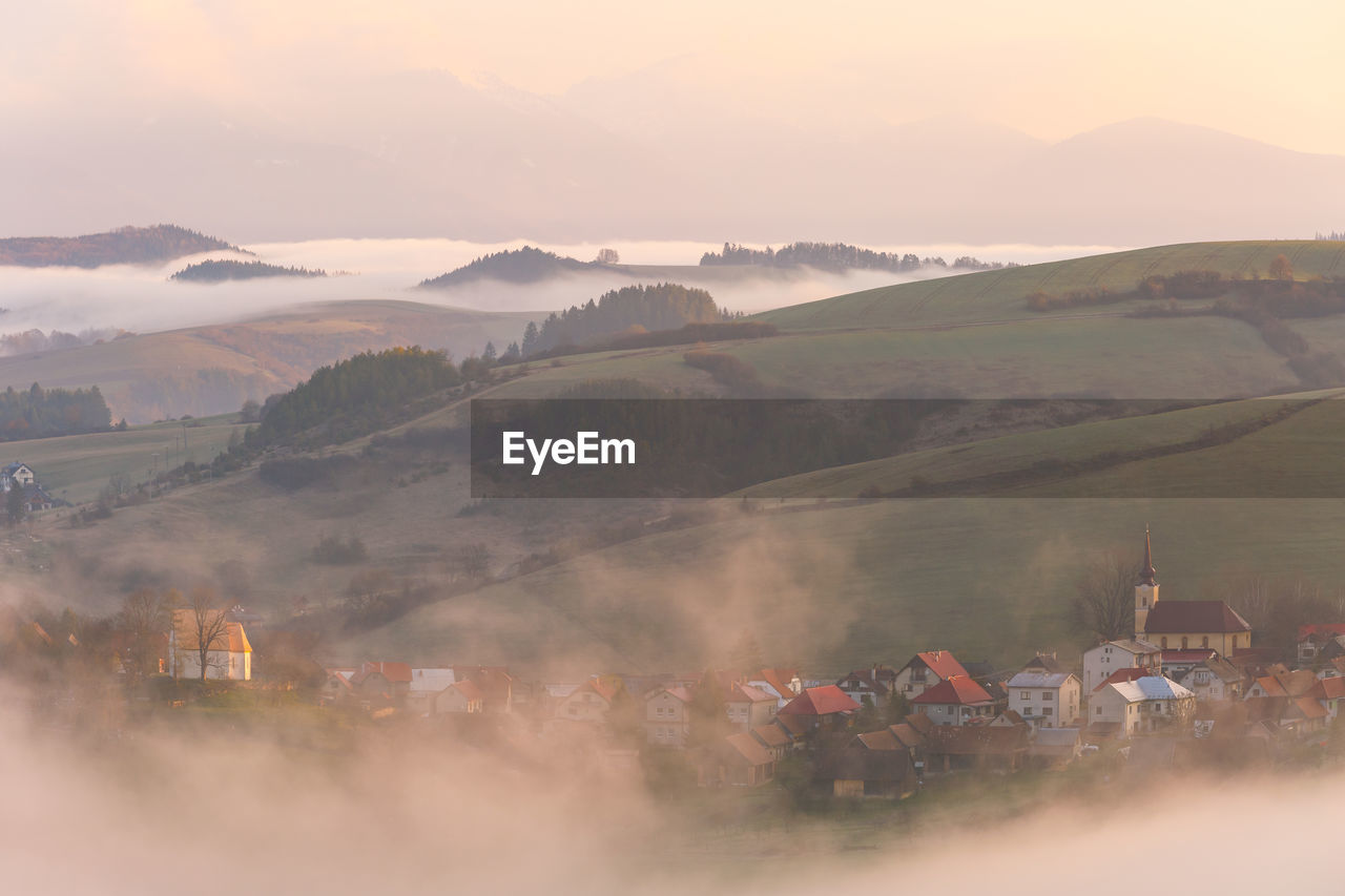 Village in turiec region on a fogy morning, northern slovakia.