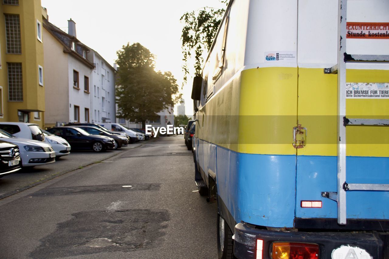 Rear view of an unimog hentschel vintage campervan with ukrainian flag painted on the body