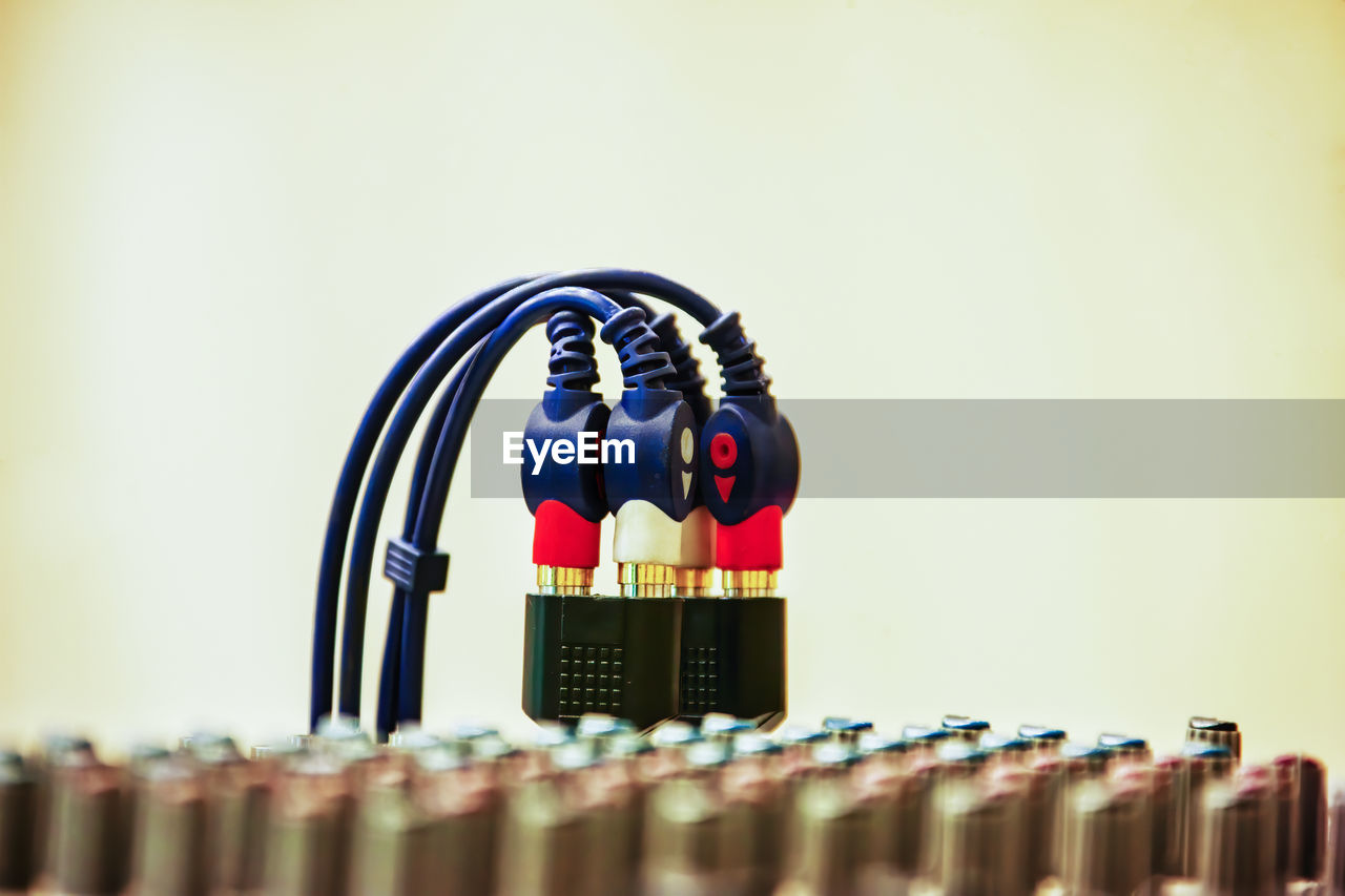 Close-up of electrical wire against white background