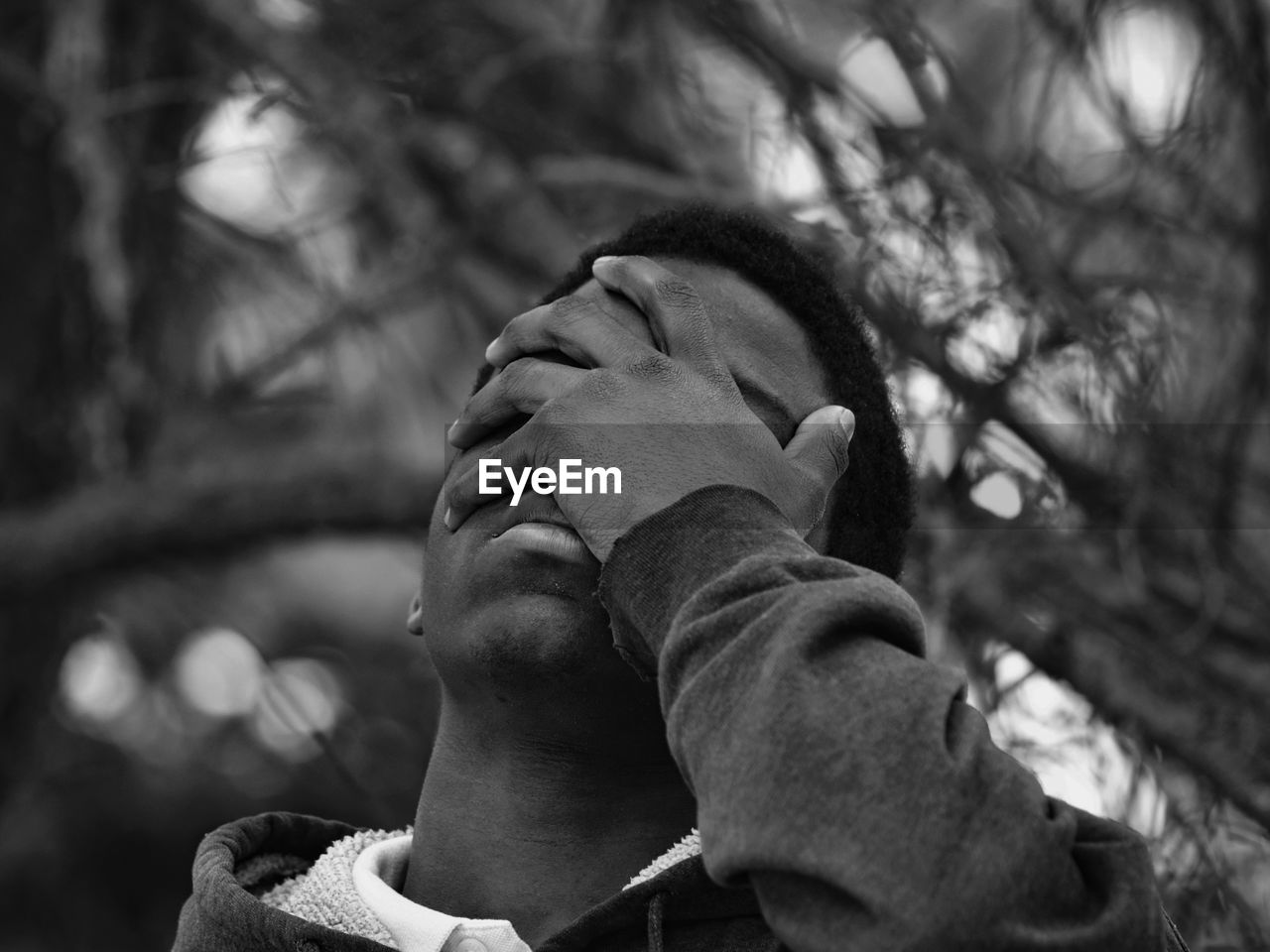 Close-up of man covering face